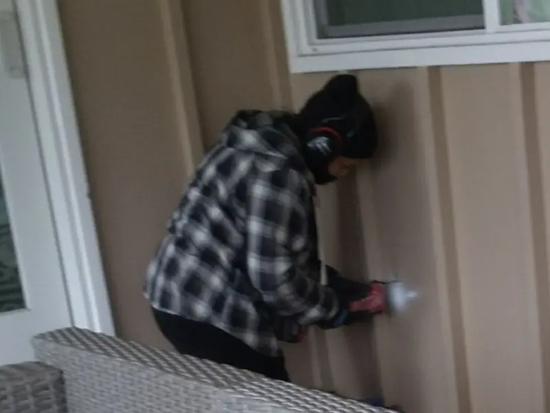 Professional electrician installing an exterior outlet in Decatur