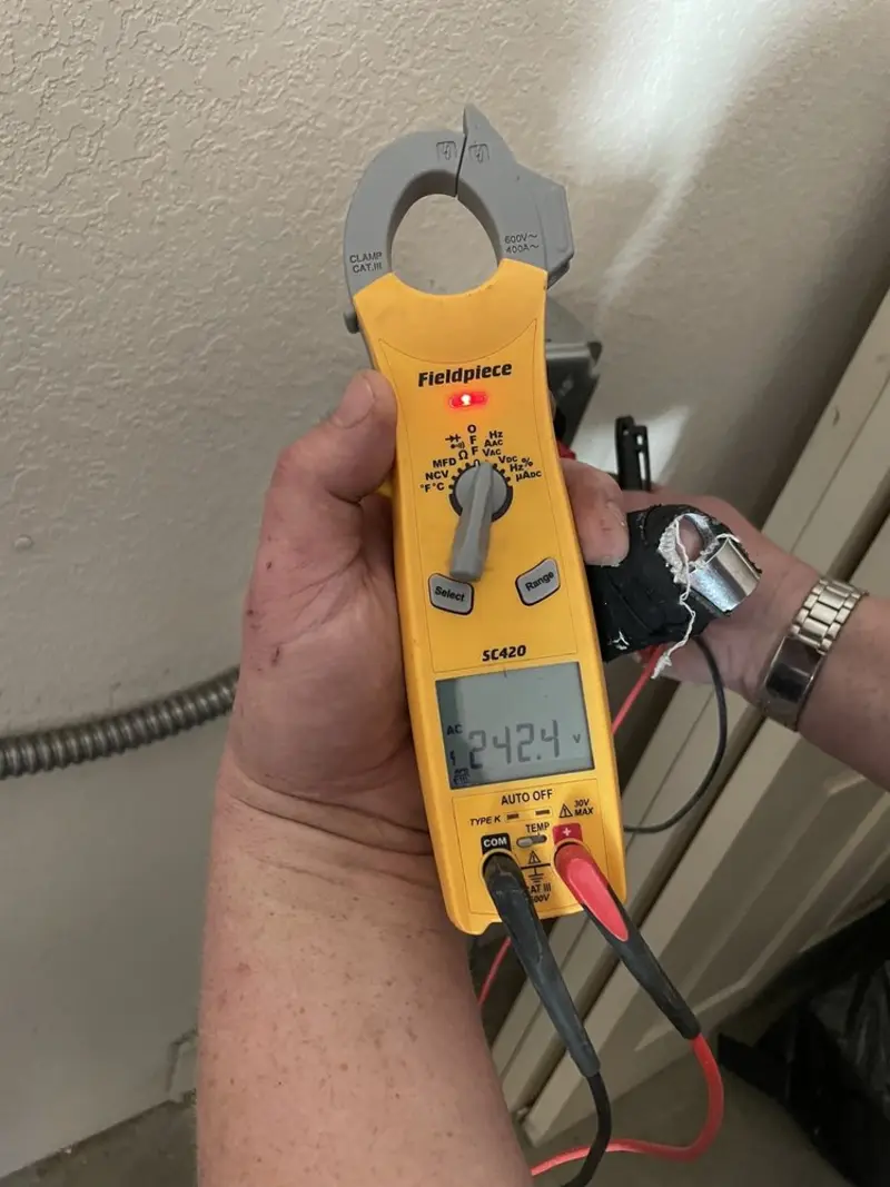 Voltage testing with clamp meter during Whole House Surge Protector in Decatur